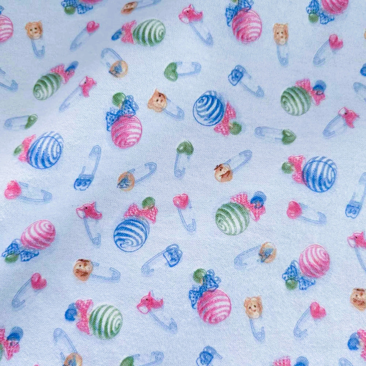 Baby Rattle and Safety Pins Flannel – Light Blue | 100% Cotton Nursery Fabric by Mai Designs