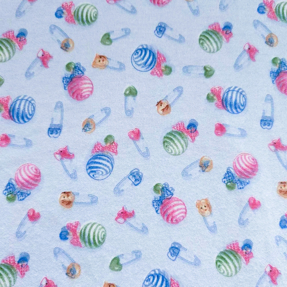 Baby Rattle and Safety Pins Flannel – Light Blue | 100% Cotton Nursery Fabric by Mai Designs