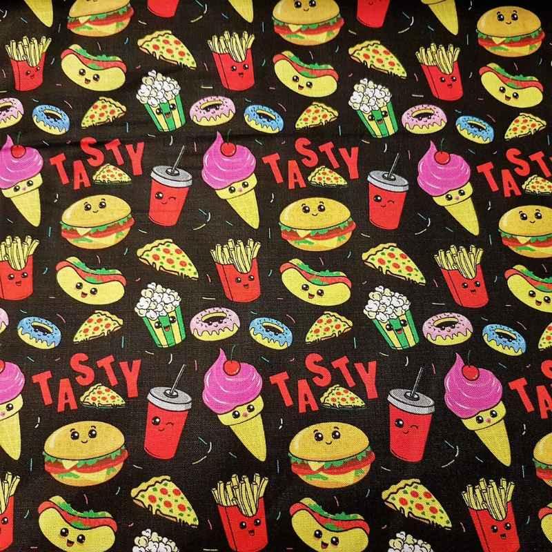 Zozo Designs Tasty Food Faces fabric with smiling burgers, fries, pizza, ice cream, donuts, popcorn, and soda on a black background.