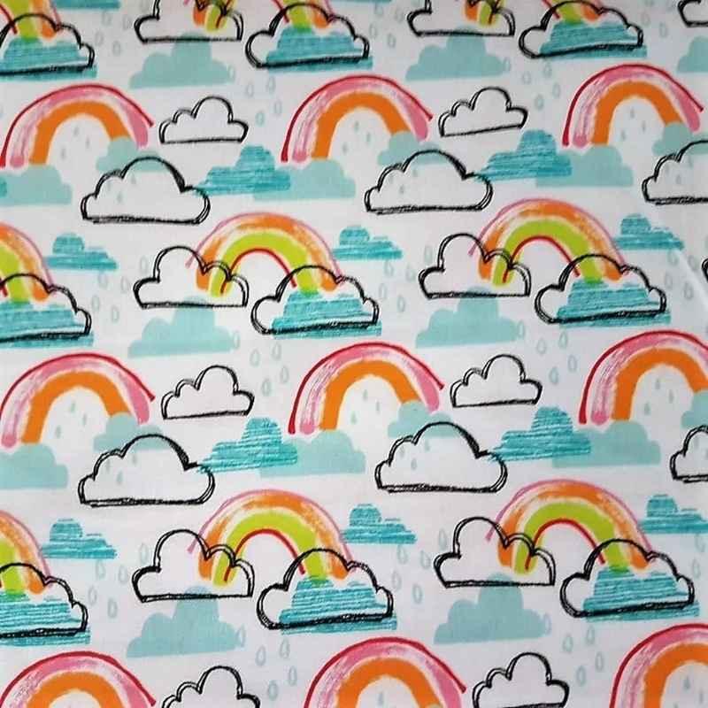 White cotton fabric with colorful rainbow and clouds print, novelty quilting fabric.