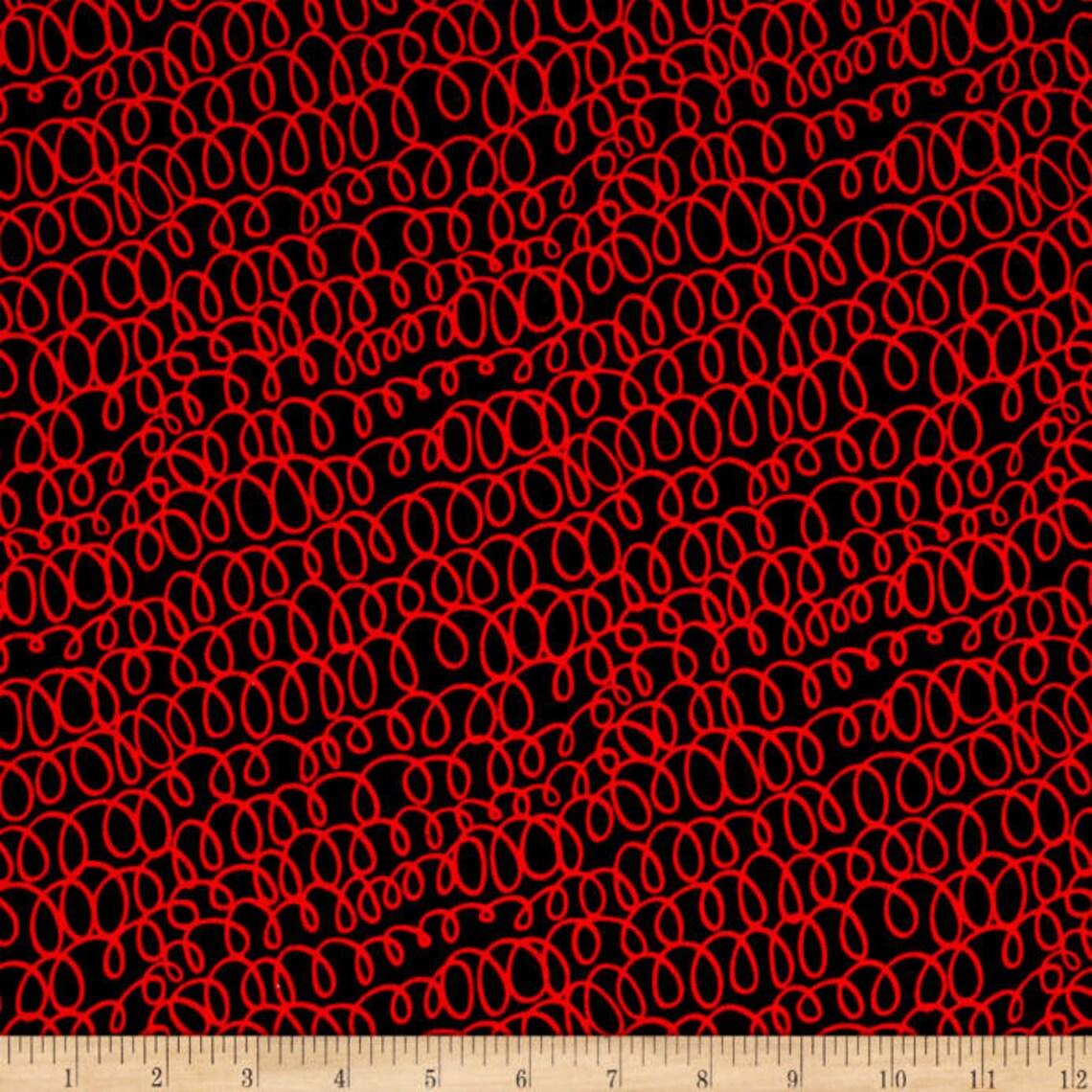 Wooly Bully C8709 fabric by Maria Kalinowski for Kanvas/Benartex featuring bold red swirls on black, 100% cotton for quilting and crafts with ruler.