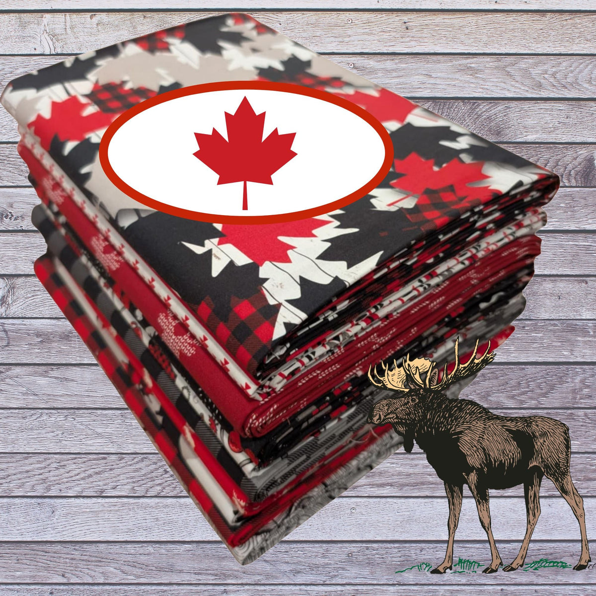 North of Ordinary fabric bundle with stacked red, black, grey, and white Canadian-themed cotton prints featuring maple leaves, moose, buffalo plaid, and knit textures, displayed on rustic wood with a moose illustration.