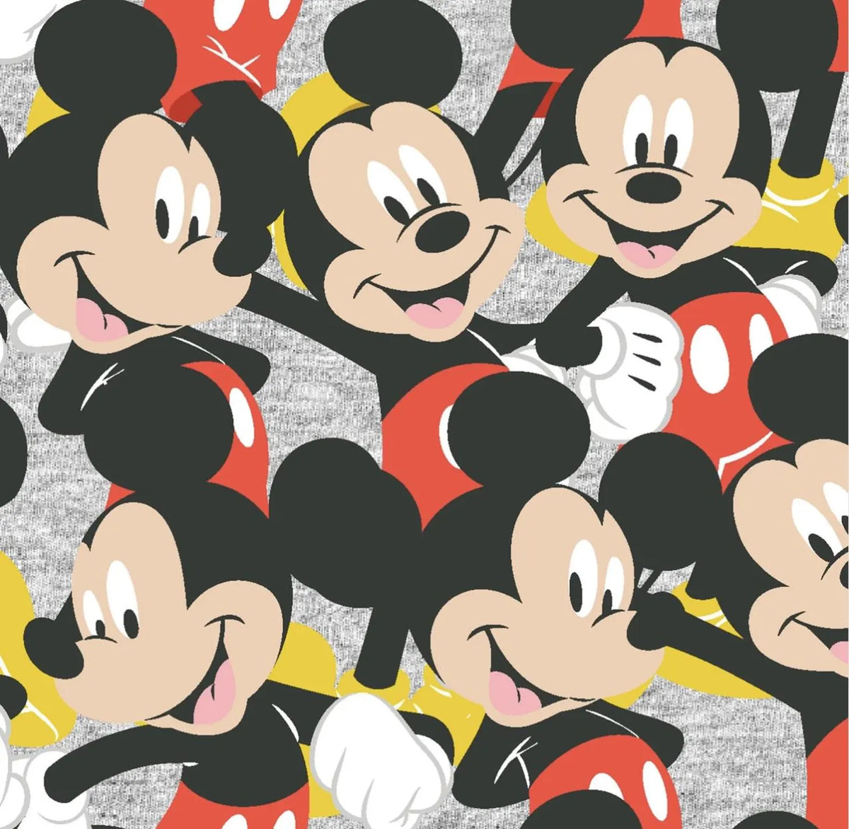 Mickey Mouse figures in red shorts, yellow shoes and white gloves packed across cotton fabric with a mottled grey background.