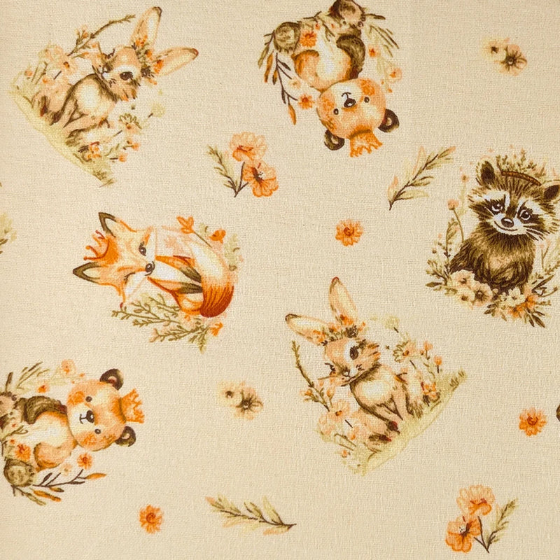 Woodland Friends cream cotton flannel fabric with foxes, rabbits, raccoons, pandas and floral accents.