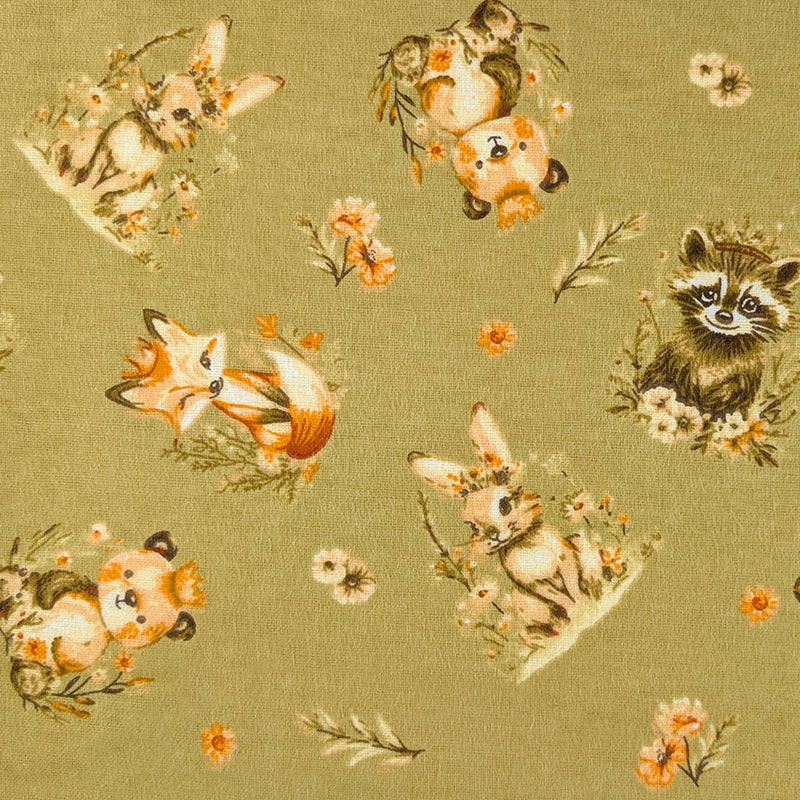 Woodland Friends sage cotton flannel fabric with foxes, rabbits, raccoons, pandas and floral accents.