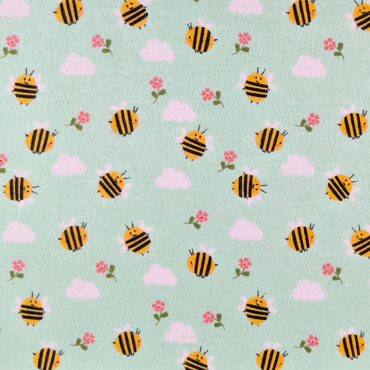 Camelot Fabrics Bumble Bees aqua cotton flannel fabric featuring yellow bees, pink flowers, and fluffy clouds from the Fleece and Flannel 2026 Collection.