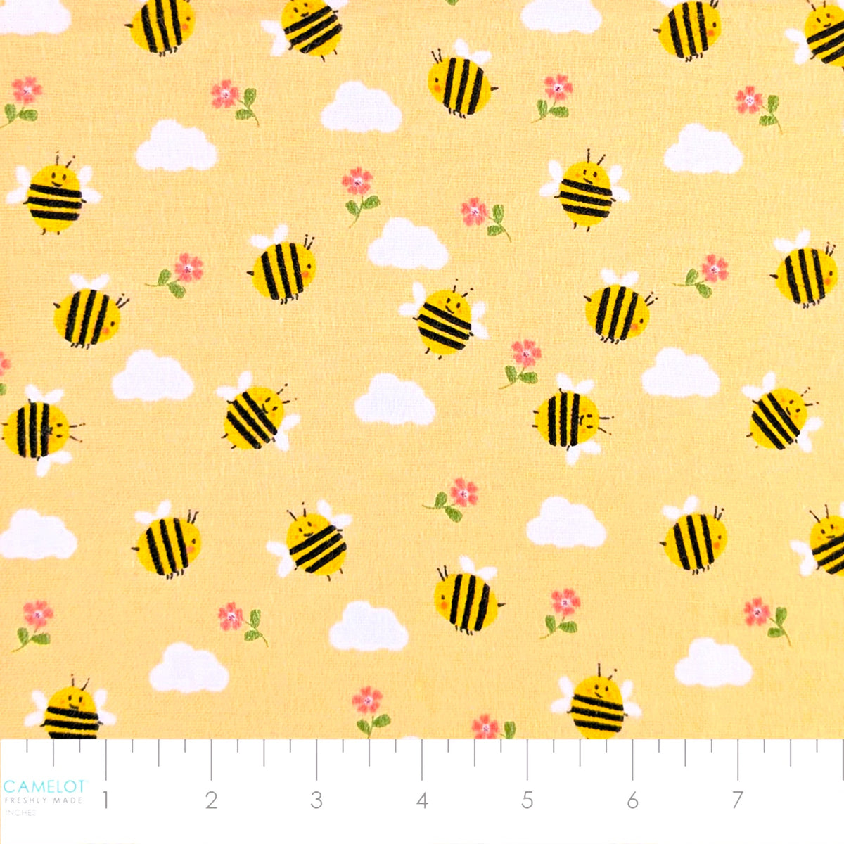 Camelot Fabrics Bumble Bees peach cotton flannel fabric featuring cheerful yellow bees, fluffy clouds, and pink flowers from the Fleece and Flannel 2026 Collection.