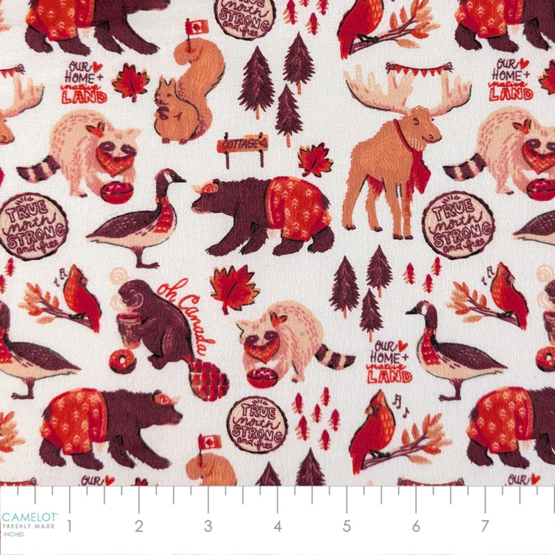 Camelot Fabrics Canadian Animals white cotton flannel fabric featuring bears, moose, beavers, geese, cardinals, and autumn woodland motifs.