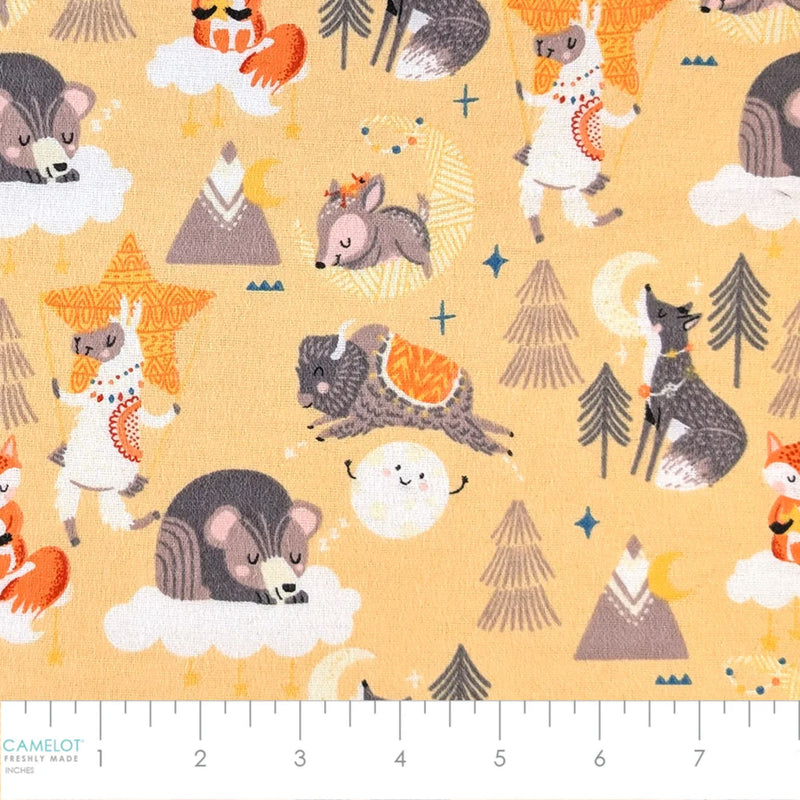 Desert Baby yellow cotton flannel fabric featuring foxes, llamas, wolves, buffalo, bears, mountains, clouds, moons, and stars.