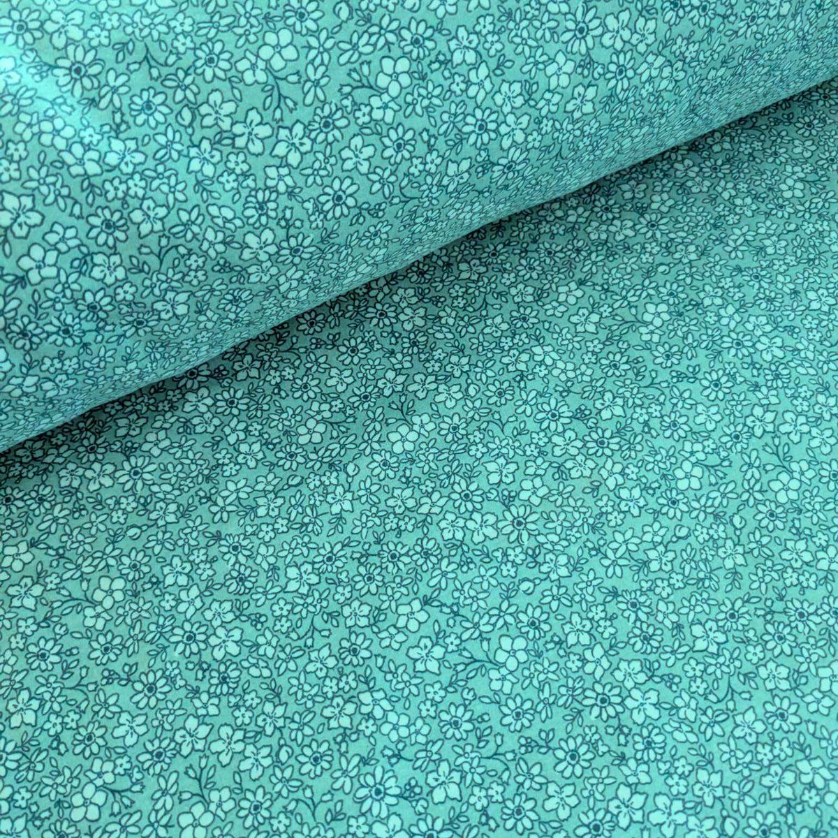 108 inch wide brushed cotton flannel wideback with aqua floral print for seamless quilt backing