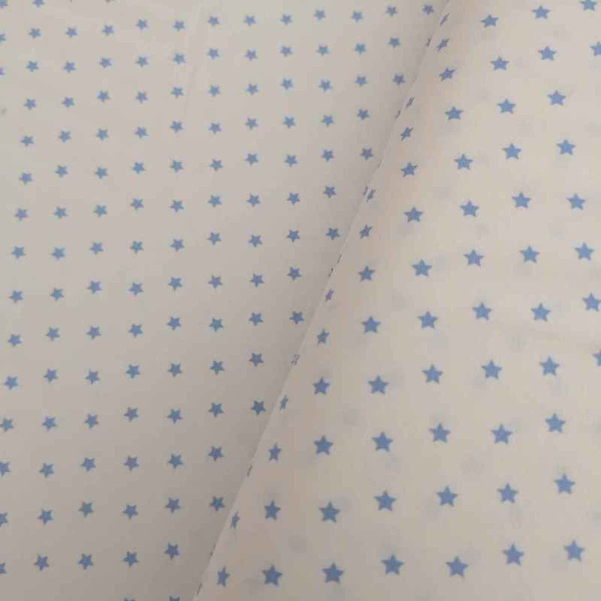 Organic cotton jersey knit fabric with blue star pattern on white background