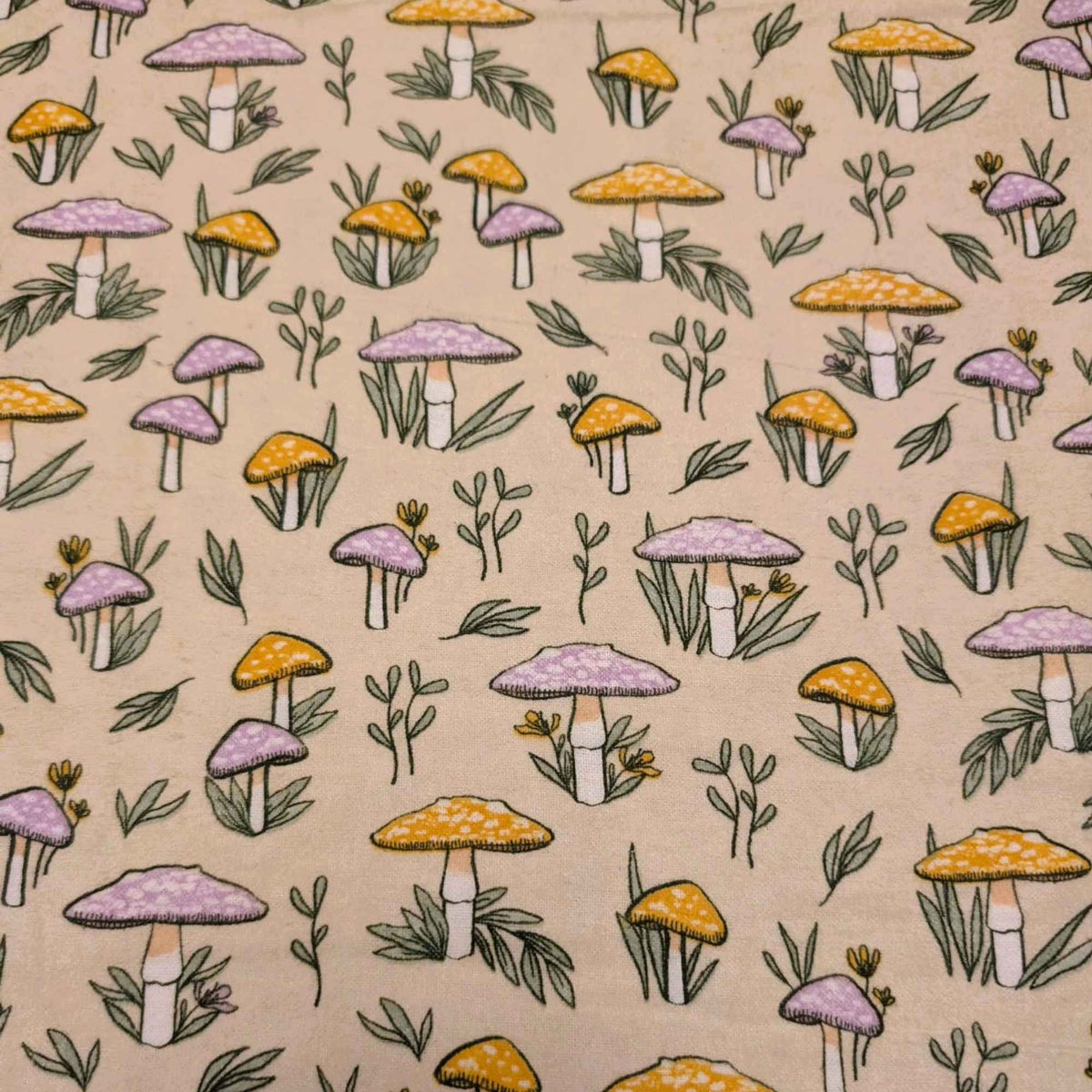 108 inch wide brushed cotton flannel wideback with mushroom and leaf print on cream background for quilt backing