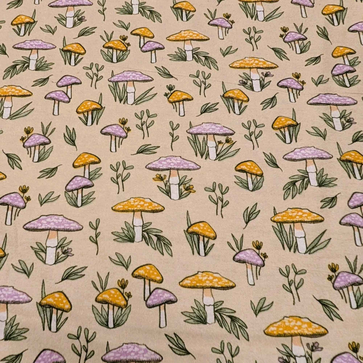 108 inch wide brushed cotton flannel wideback with mushroom and leaf print on cream background for quilt backing