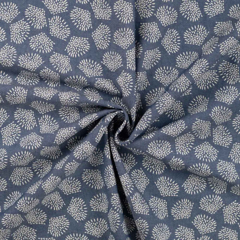 Blue chambray cotton fabric with white leaf print lightweight woven fabric for apparel quilting and sewing projects