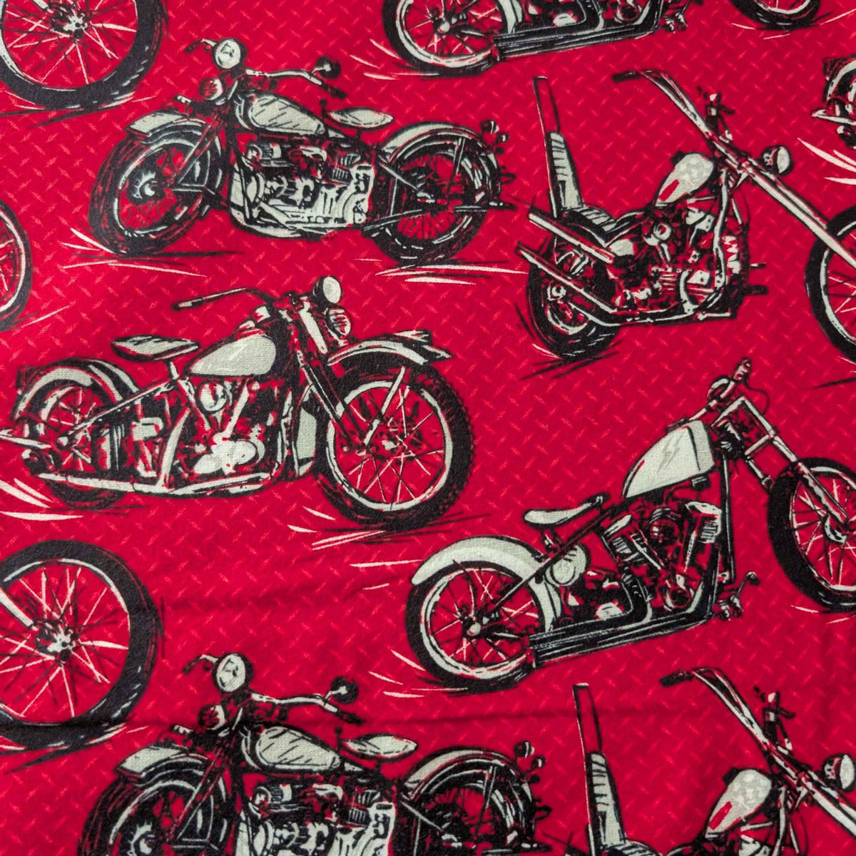 Red cotton flannel fabric with black and grey motorcycle print, brushed soft, OEKO-TEX certified, 44 inches wide.