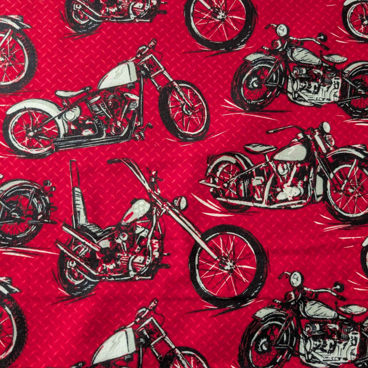 Red cotton flannel fabric with black and grey motorcycle print, brushed soft, OEKO-TEX certified, 44 inches wide.