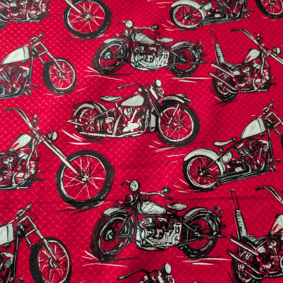 Red cotton flannel fabric with black and grey motorcycle print, brushed soft, OEKO-TEX certified, 44 inches wide.