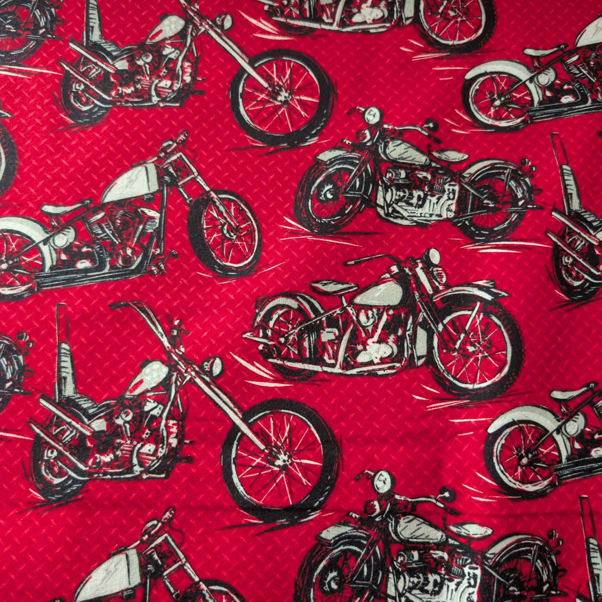 Red cotton flannel fabric with black and grey motorcycle print, brushed soft, OEKO-TEX certified, 44 inches wide.
