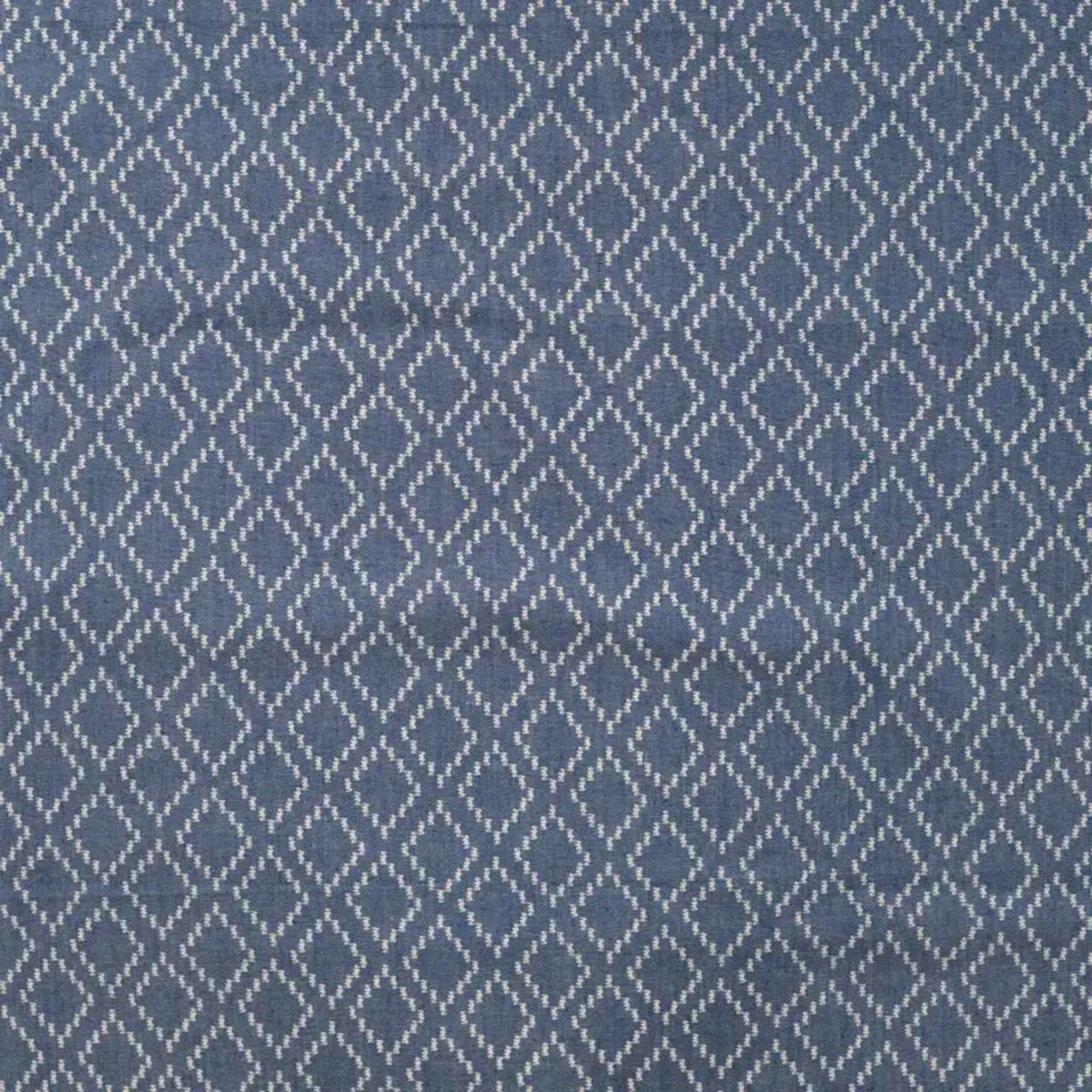 Blue chambray cotton fabric with white geometric diamond pattern lightweight woven fabric for apparel quilting and sewing projects