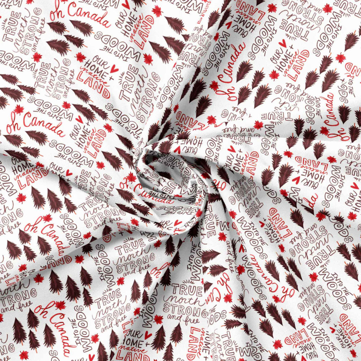 "Strong and Free Canadian text cotton fabric with maple leaves and pine trees on white by Camelot Fabrics"