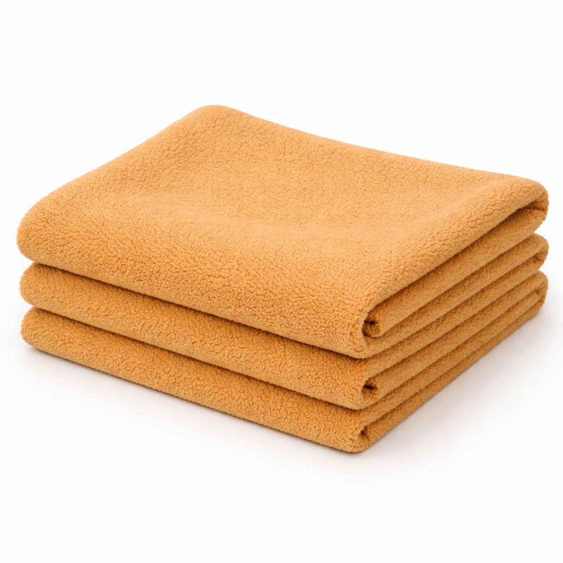 Honey anti-pill polar fleece fabric folded stack – soft golden yellow polyester fleece fabric by the yard