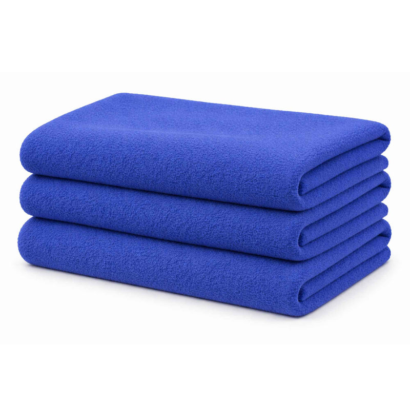 Royal blue anti-pill polar fleece fabric with soft ripple texture, close-up view showing plush fibers and gentle waves.