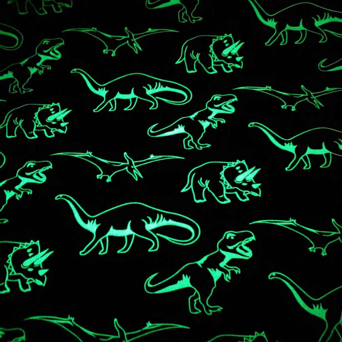 Glow in the dark dinosaur cotton flannel fabric with white dinosaur silhouettes on dark background, soft brushed quilting fabric