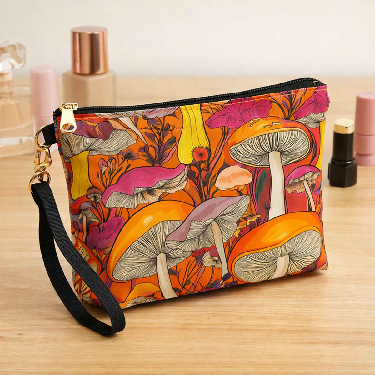 Makeup pouch made with Bright retro mushroom print food safe waterproof polyurethane laminate fabric with orange background and pink, yellow and coral mushrooms.