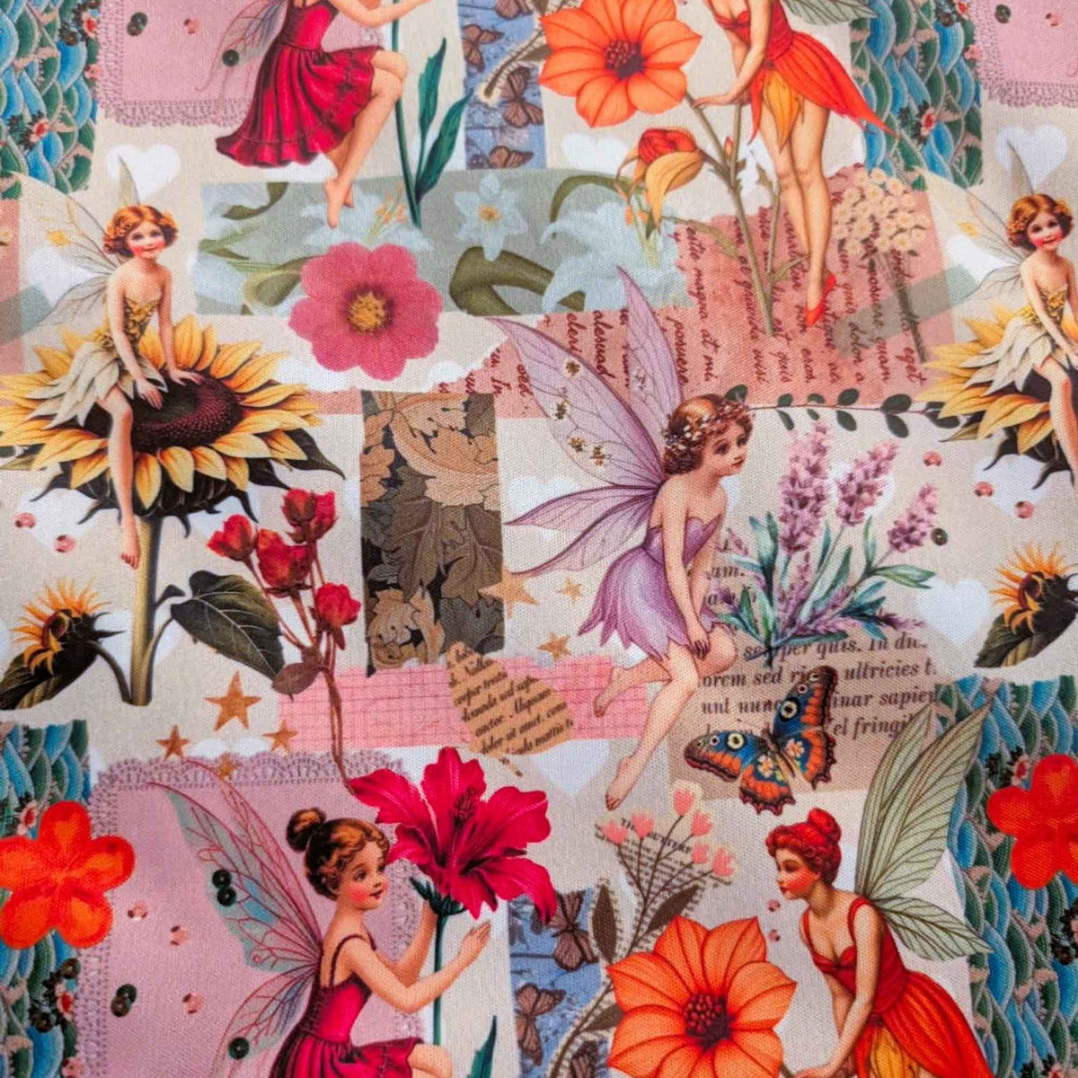 A close-up of a vintage-style fabric or wallpaper pattern featuring fairies, large flowers, butterflies, and collage-text elements in pink, orange, red, green, and beige tones.