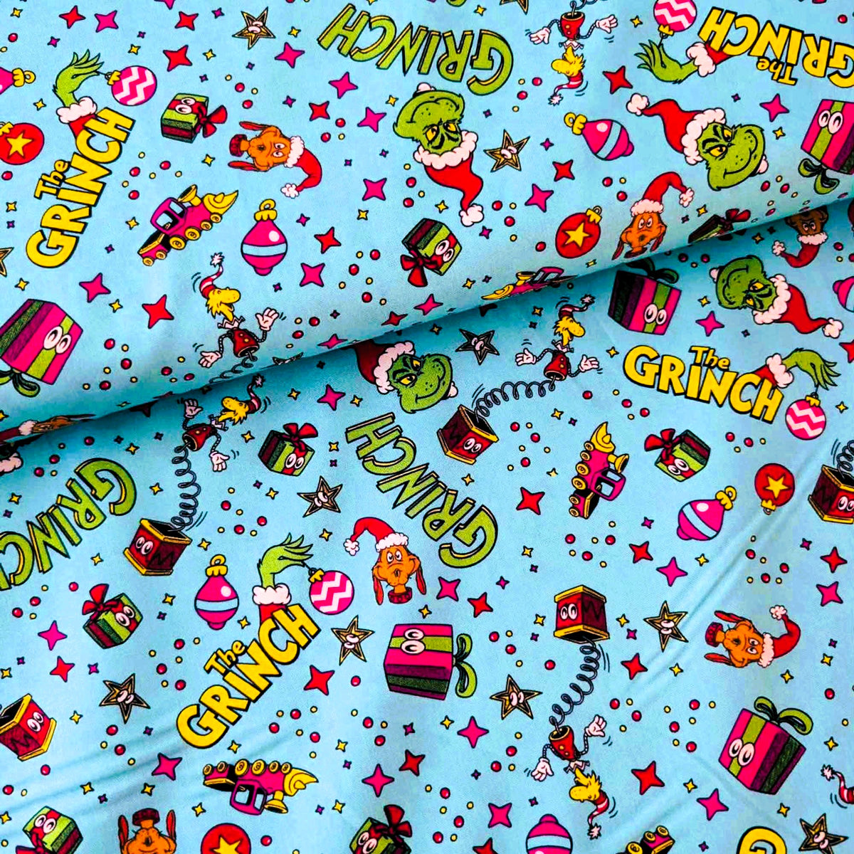 How the Grinch Stole Christmas Toy Toss cotton fabric on aqua by Robert Kaufman
