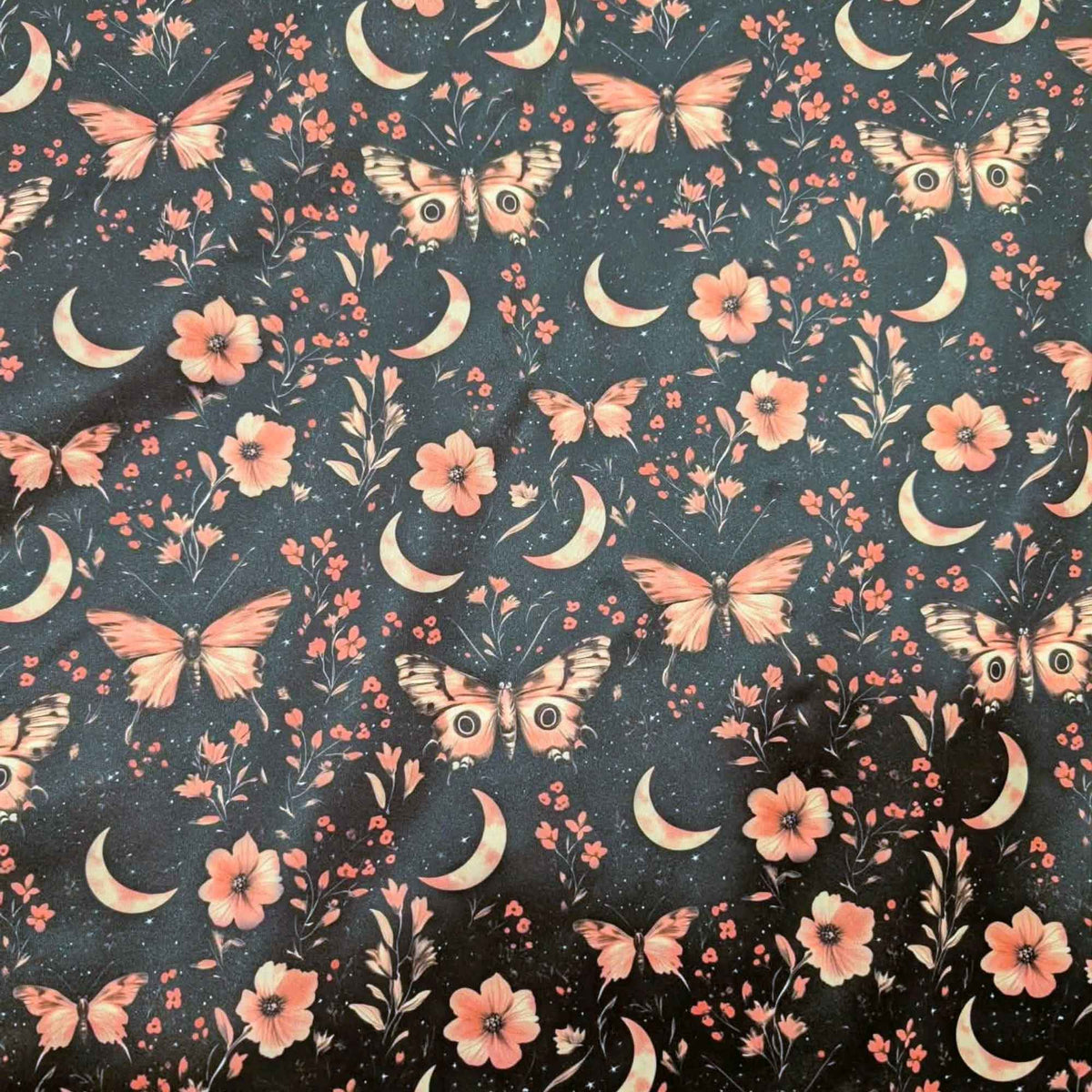 Moonlit Blush Moths exclusive waterproof PUL fabric with pink moths, crescent moons, flowers and stars on a black background