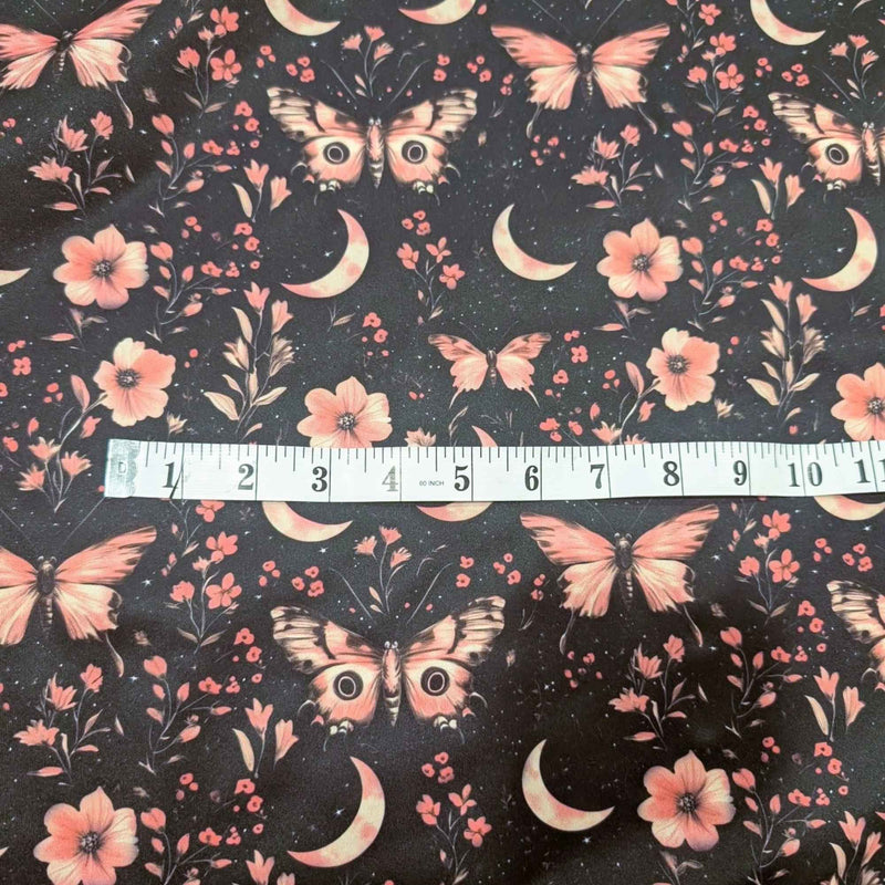 Moonlit Blush Moths exclusive waterproof PUL fabric with pink moths, crescent moons, flowers and stars on a black background