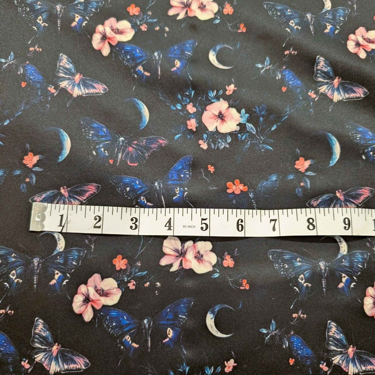 Midnight Butterfly Moon Garden exclusive waterproof PUL fabric with blue butterflies, pink flowers and crescent moons on black