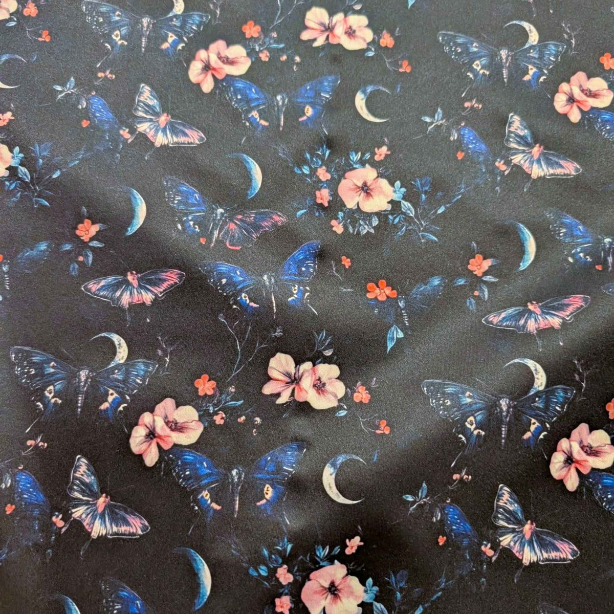 Midnight Butterfly Moon Garden exclusive waterproof PUL fabric with blue butterflies, pink flowers and crescent moons on black