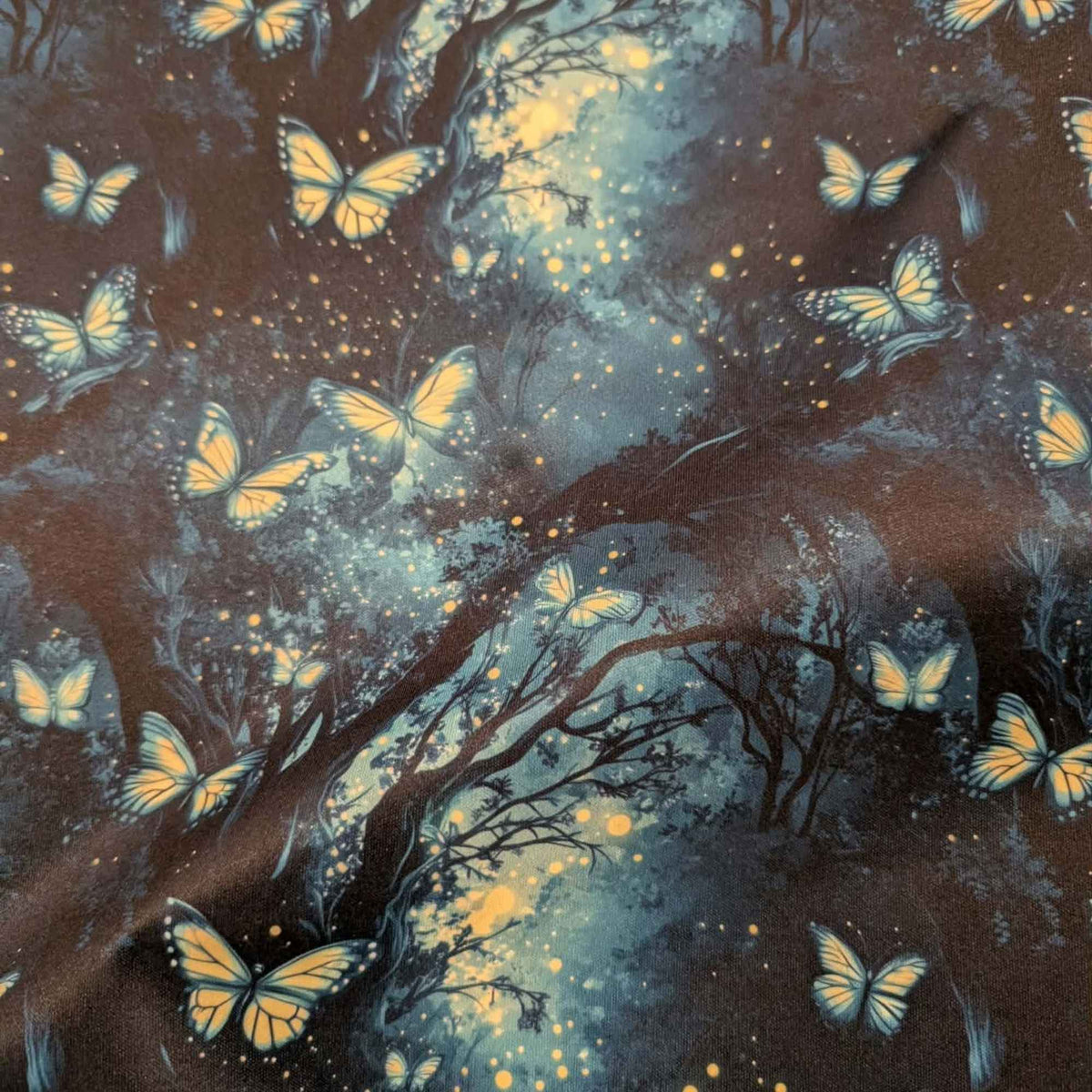 Enchanted Butterfly Forest exclusive waterproof PUL fabric with glowing butterflies and fireflies among dark teal woodland trees