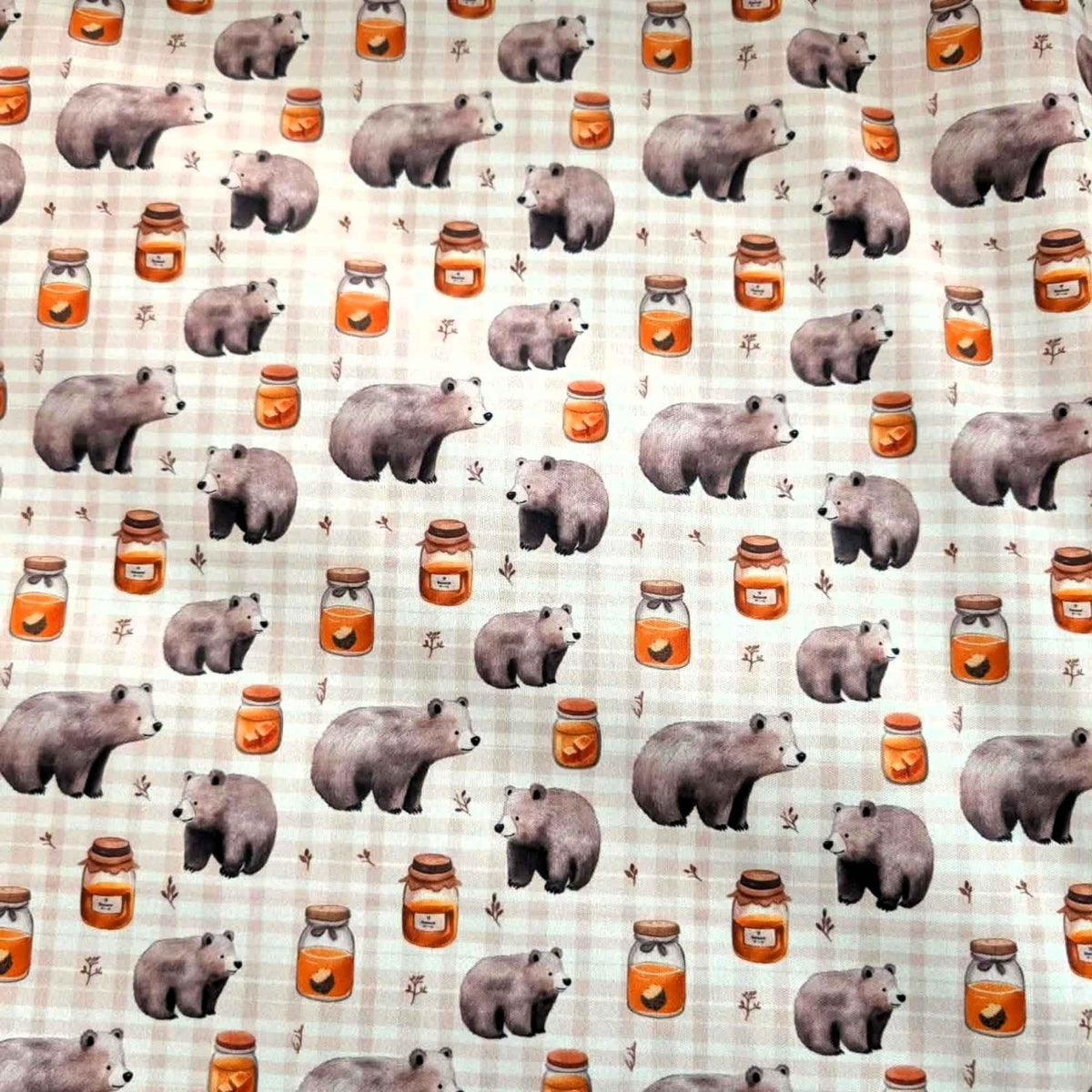 Honey Bear exclusive waterproof PUL fabric with brown bears, golden honey jars and botanical sprigs on a cream checked background