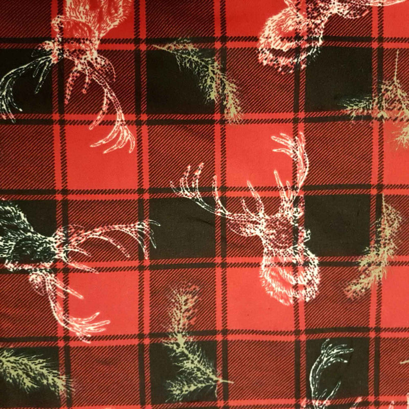 Red and black plaid cotton flannel fabric with white and green deer illustrations, brushed double sided