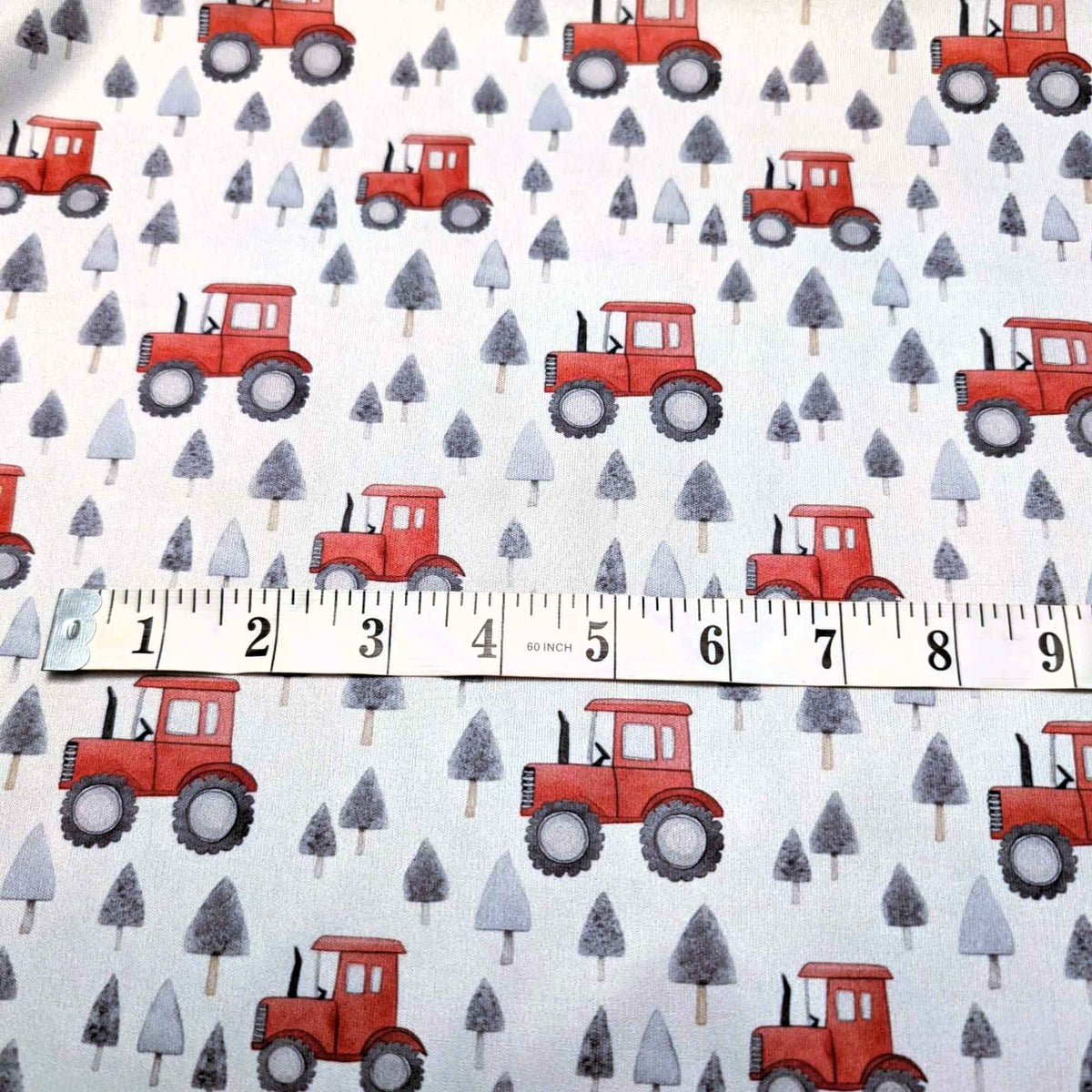 Red tractor and grey pine tree waterproof PUL fabric with farm theme print