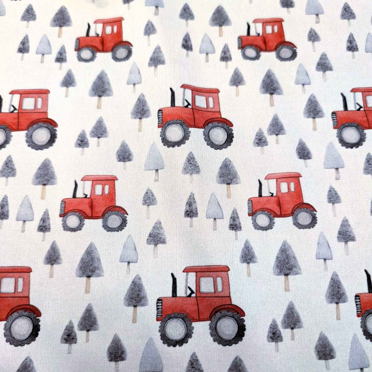 Red tractor and grey pine tree waterproof PUL fabric with farm theme print