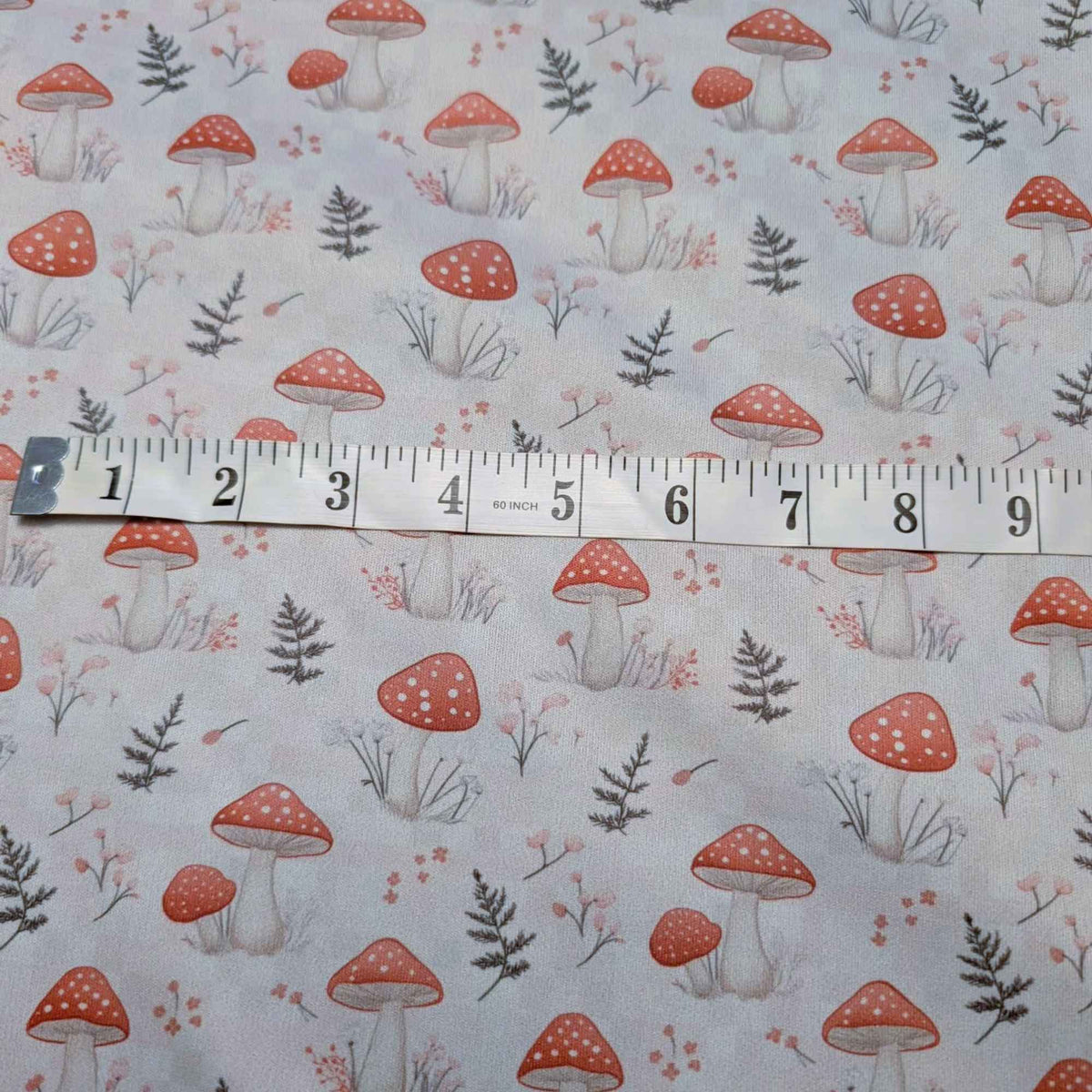 Red mushroom PUL fabric scale reference showing repeat size waterproof fabric