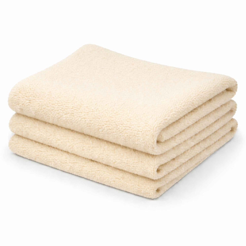 Cream anti-pill polar fleece fabric folded stack soft polyester fleece by Camelot Fabrics