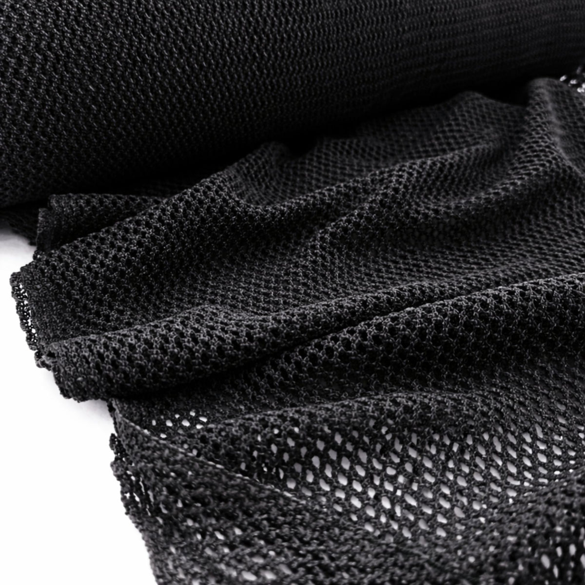 Black fish net mesh fabric showing open knit breathable texture draped in soft folds