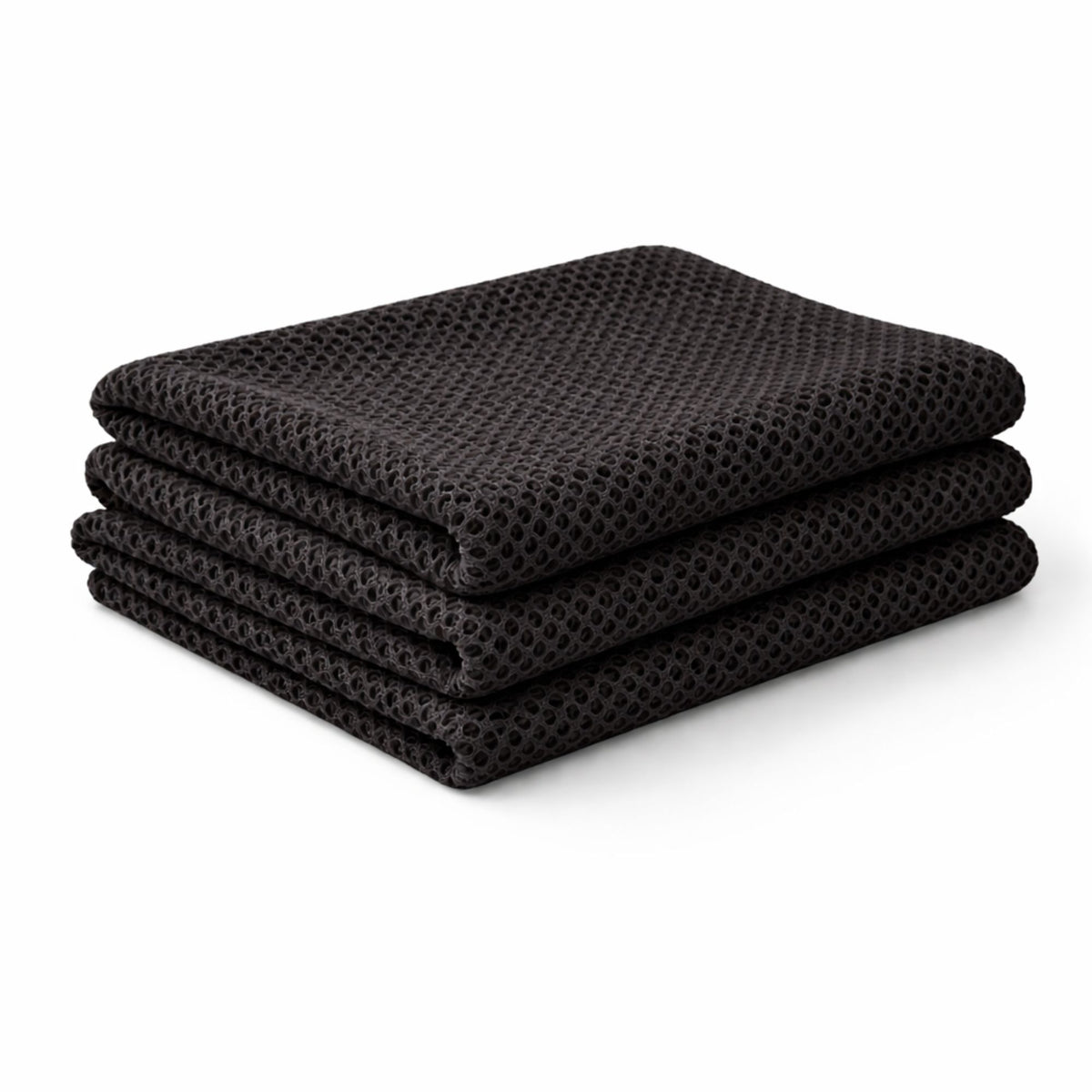 Black fish net mesh fabric showing open knit breathable texture draped in soft folds