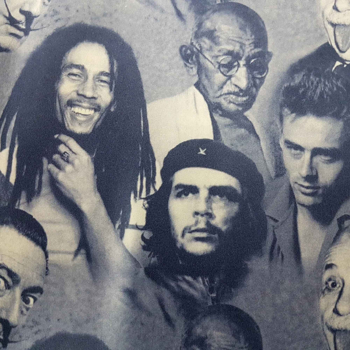 Blue grey polyester spandex fabric featuring portraits of Albert Einstein, Bob Marley, and other iconic figures in a repeating print
