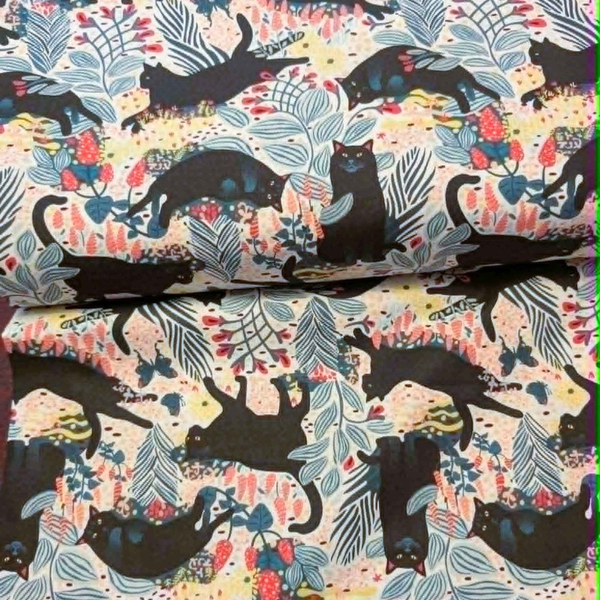 Black cat floral novelty quilting cotton fabric with leaves and butterflies on a light background