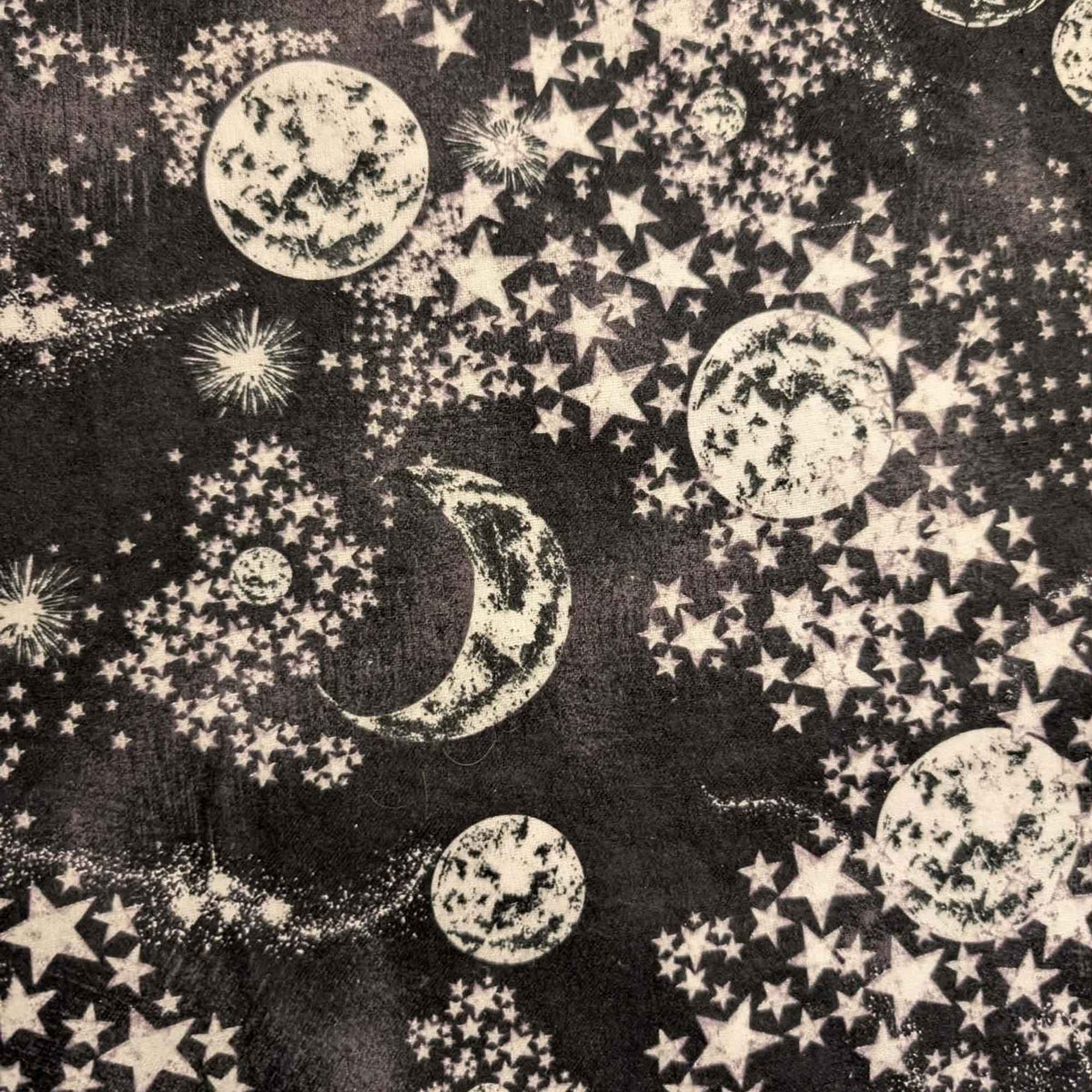 Constellation cotton flannel fabric with moon and stars pattern on dark background, soft brushed quilting fabric