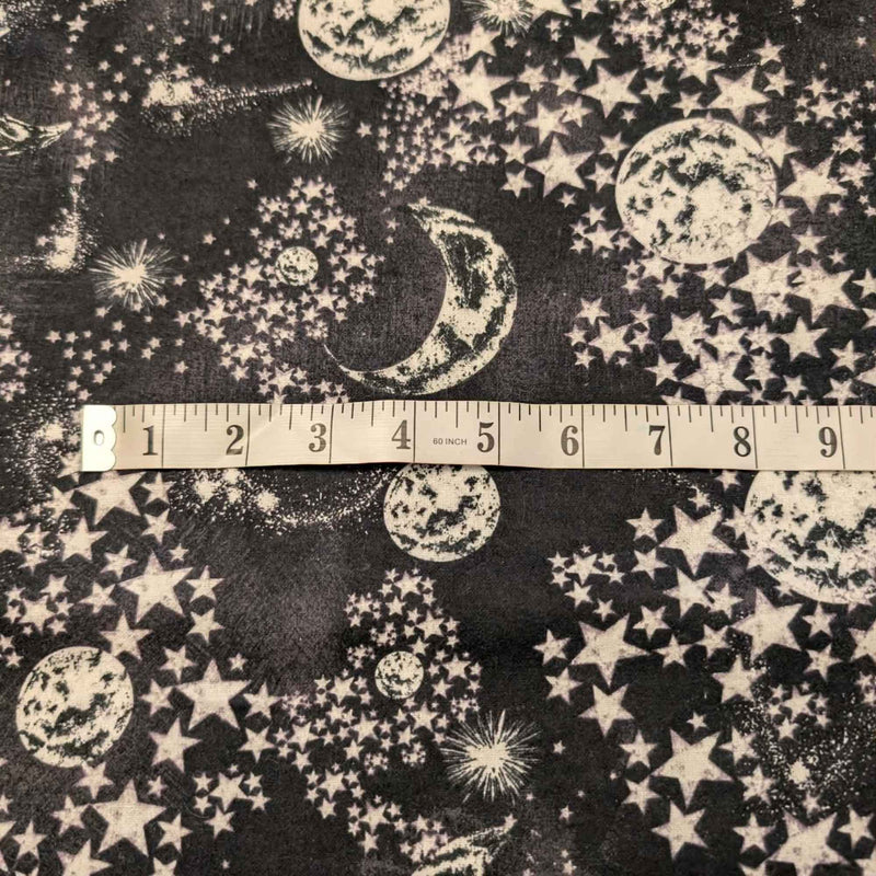 Constellation cotton flannel fabric with moon and stars pattern on dark background, soft brushed quilting fabric