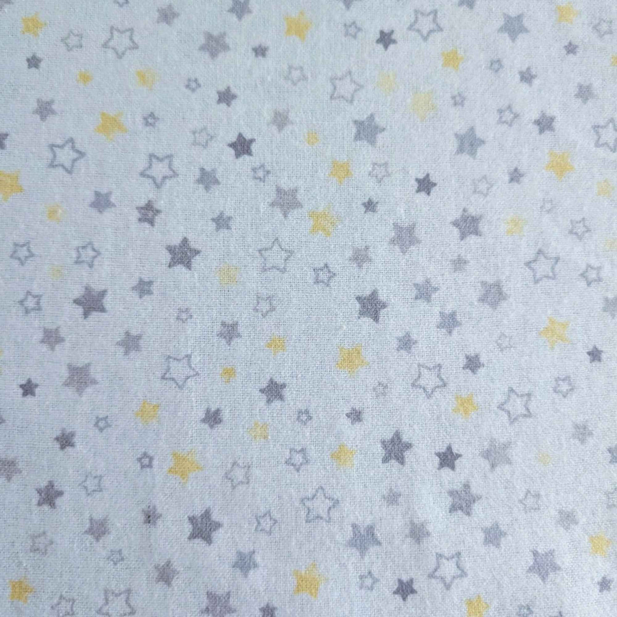 Light blue fabric with a repeating pattern of small stars in gray and yellow.