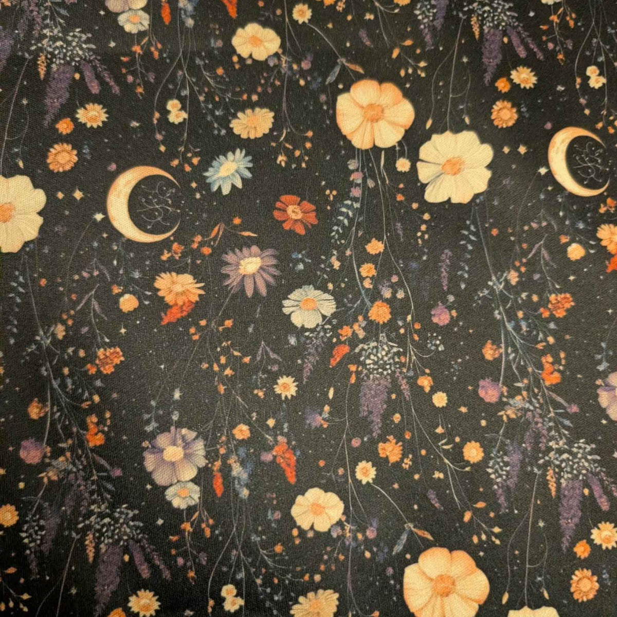 Moonlit Wildflower Garden exclusive waterproof PUL fabric with golden crescent moons and colourful wildflowers on a black background