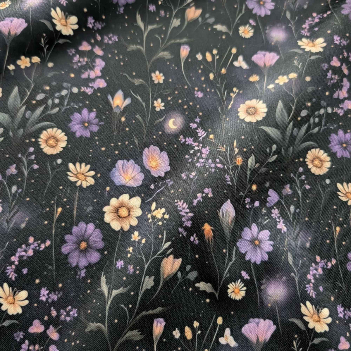Starlit Wildflower Meadow exclusive waterproof PUL fabric with purple and golden flowers, crescent moons and glowing stars on black